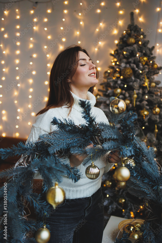 Cute girl in New Year's locations in a cozy living room. Woman at home for the new year.