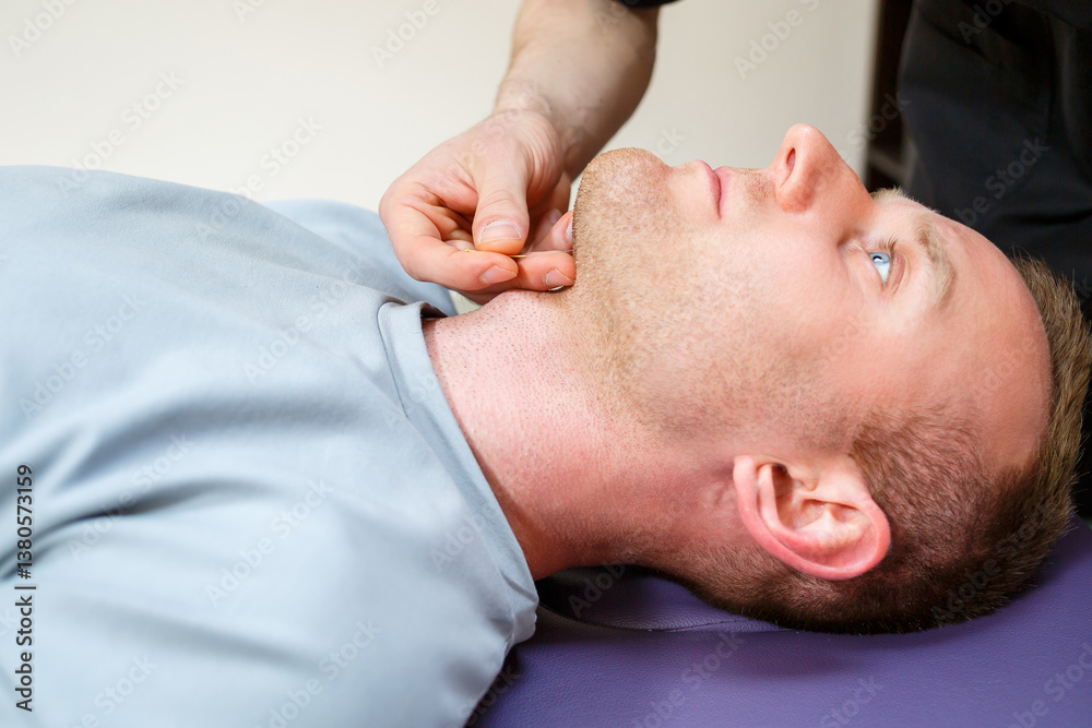 Chiropractic Treatment This involves the Professional Manual Manipulation of a Patients Jaw during a Therapy Session aimed at improving health and wellness through specialized techniques
