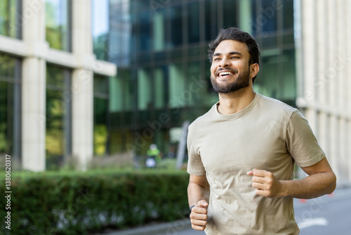 Photography Close-up photo of a young smiling Indian man exercising outdoors, doing a mornin