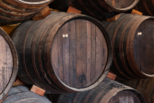 Barrels of wine stacked in a winery in Mollina, Andalusia, Spain, Europe