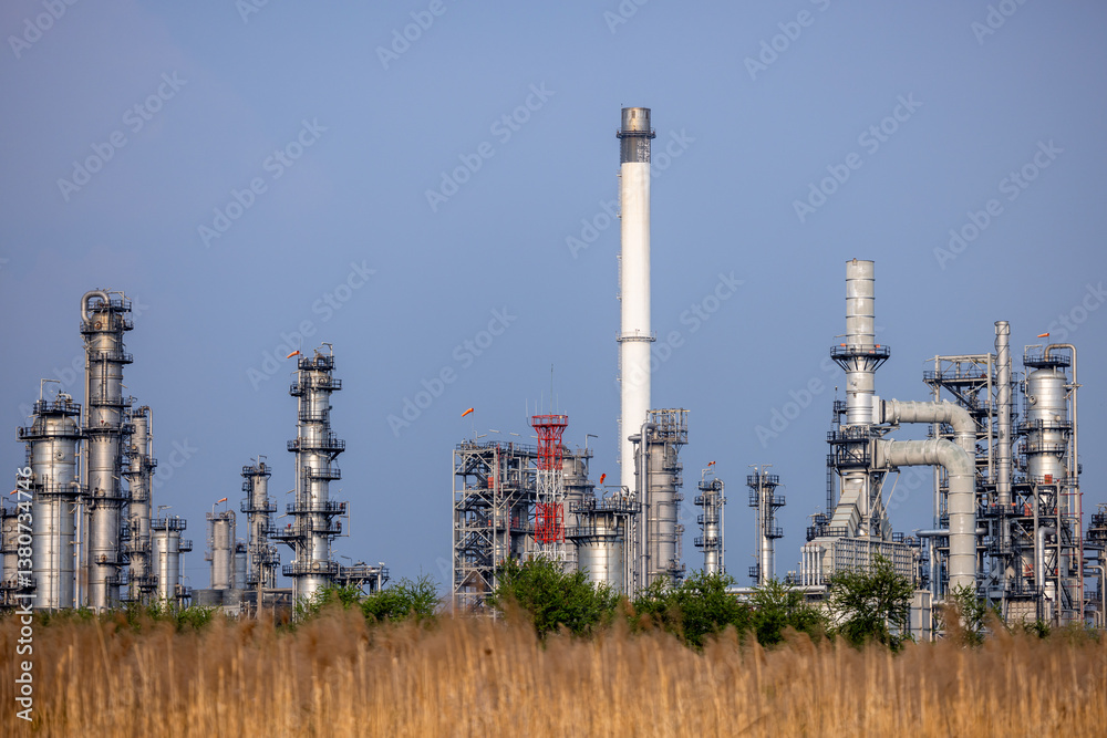 Oil and gas refinery industrial factory plant with blue sky background at oil and gas refinery zone, Business oil and gas industrial plant, Oil and gas refinery petrochemical plant industrial. Oil and gas refinery industrial factory plant with blue sky background at oil and gas refinery zone, Business oil and gas industrial plant, Oil and gas refinery petrochemical plant industrial.