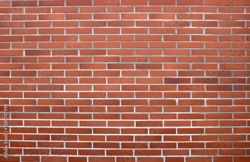 Mur de briques de couleur rouge, rose, orange