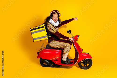 Young man in a historical costume riding a red scooter with a large backpack against a vibrant yellow background