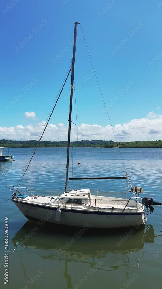 sailing boat anchored in the river sailing boat anchored in the river