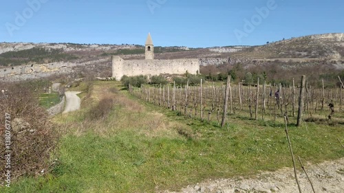 Fortified Holy Trinity Church of Hrastovlje, on a grassy knoll in rural Istria, Slovenia