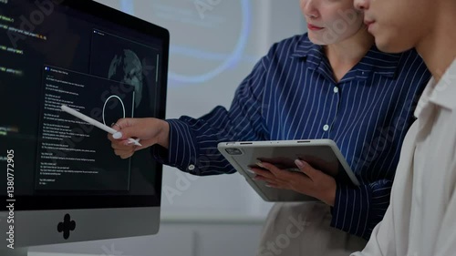 software developer talk strategy plan to executive write prompt AI bot IT app program data analytics in tech startup office.Projected visuals and glowing code on screen.AI chatbot technology concept