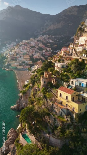 Wallpaper Mural Epic vertical shot of colorful village Positano, Amalfi coast, Italy. Fly over colorful houses, church and beach in Positano at sunset Torontodigital.ca