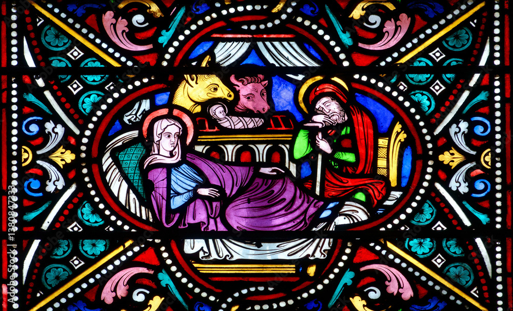 Fototapeta premium Stained glass (Nineteenth century) of Christmas Nativity Scene with Virgin Mary, Saint Joseph, and Jesus baby.