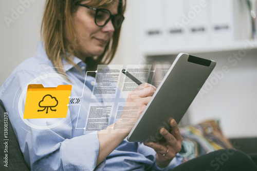 Woman edits documents on tablet. Cloud storage concept.  Digital modern workflow, remote technology photo