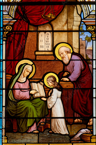 Canvas Print Stained glass (19th century) of the young Virgin Mary with her parents Saint Anne and Saint Joachim