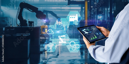 Smart industry control concept.Manager Engineer Hands holding tablet on blurred automation machine as background