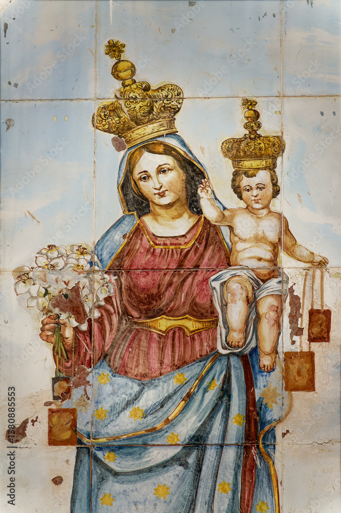 Fototapeta premium Mural painting on tiles of Blessed Virgin Mary holding baby Jesus Christ in her arms.