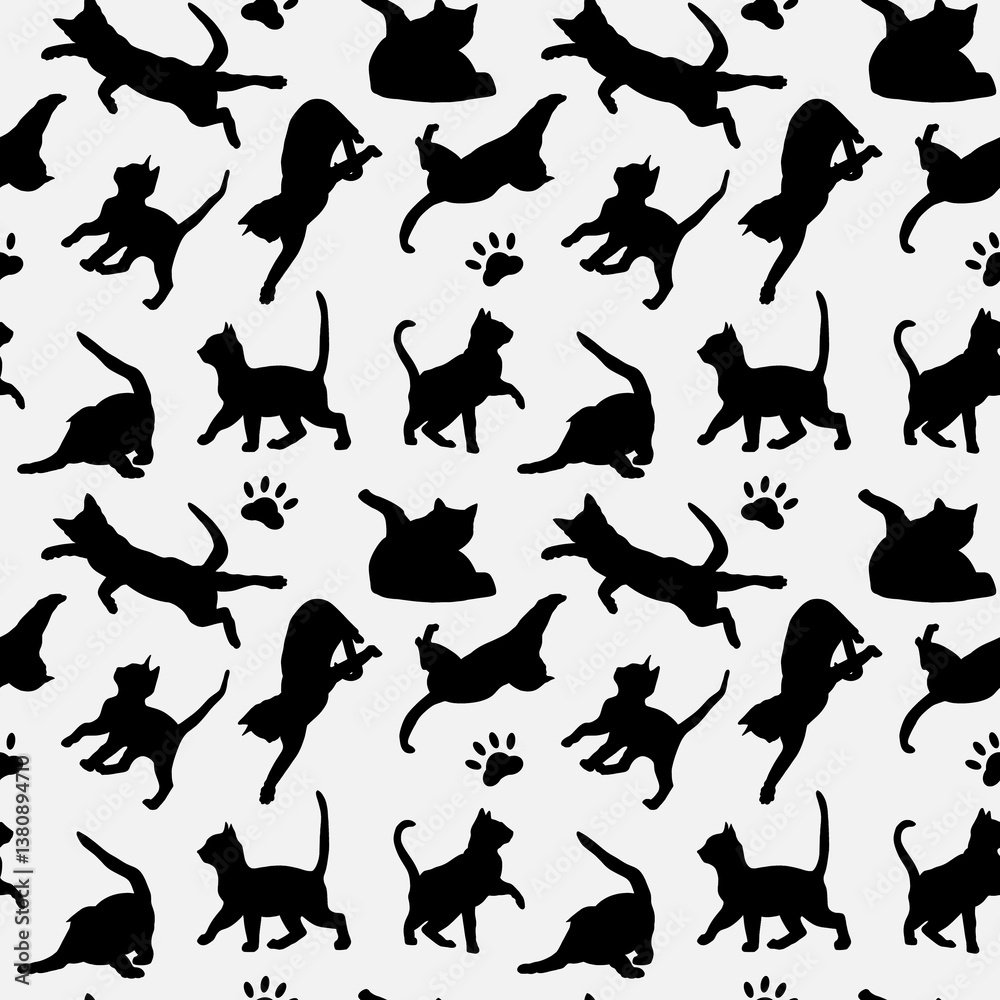 Silhouettes of playful cats in a seamless pattern design for fabric or wallpaper Silhouettes of playful cats in a seamless pattern design for fabric or wallpaper