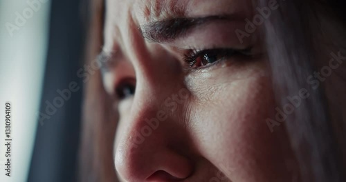 Close up a girl closes her eyes and cries her face