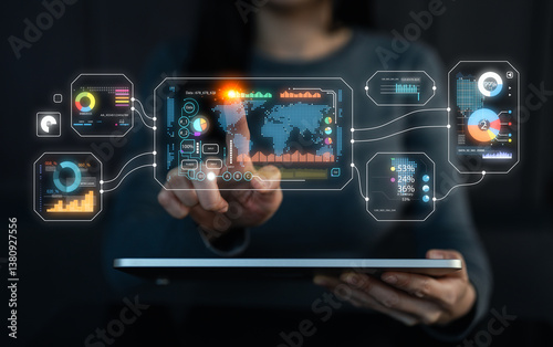 A person interacts with a digital interface displaying data visuals and analytics on a tablet, showcasing technology and innovation in data management.