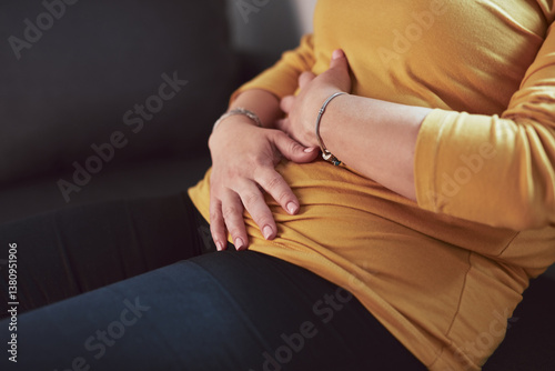 Obraz na płótnie Woman with strong stomach ache, menstrual and digestive issues at home. w salonie
