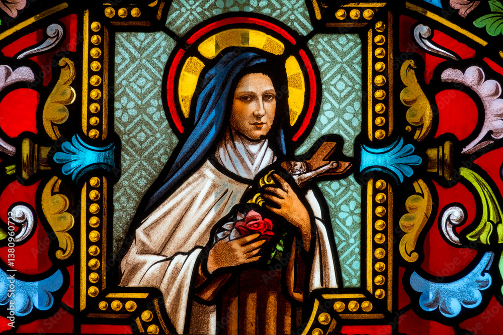 Stained glass (1931) of St. Therese of Lisieux or Thérèse de Lisieux, Carmelite nun and Saint of the Roman Catholic Church. Stained glass (1931) of St. Therese of Lisieux or Thérèse de Lisieux, Carmelite nun and Saint of the Roman Catholic Church.