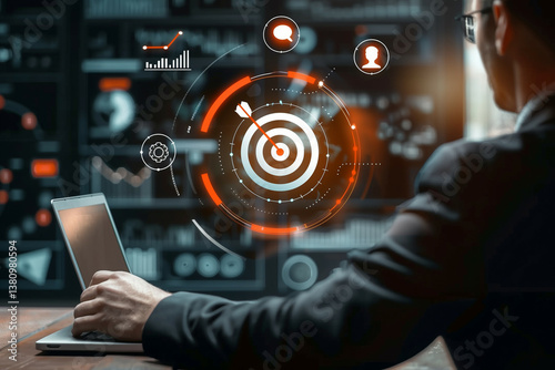 Businessman using laptop with digital target and analytics data visualization for business technology concept