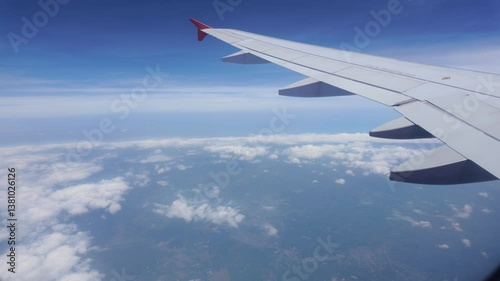 Flight adventure over clouds air travel aerial view blue sky wide angle journey of discovery