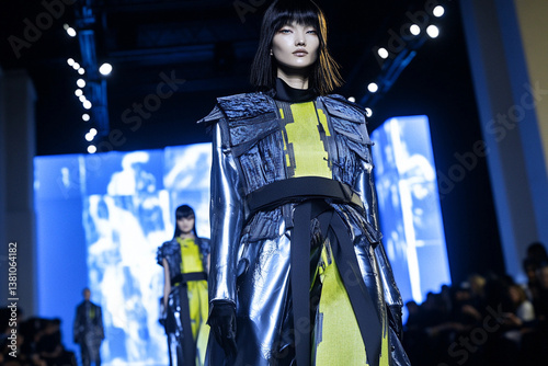 Futuristic fashion runway showcasing avant-garde designs under dramatic lighting