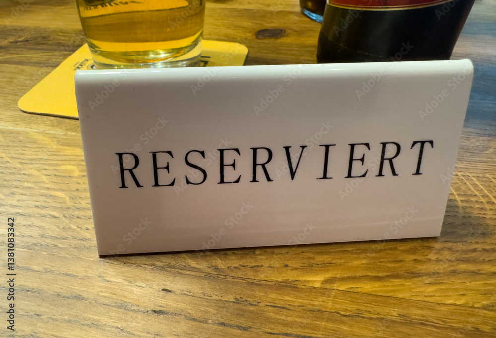 Reserved sign in German on a table in a restaurant