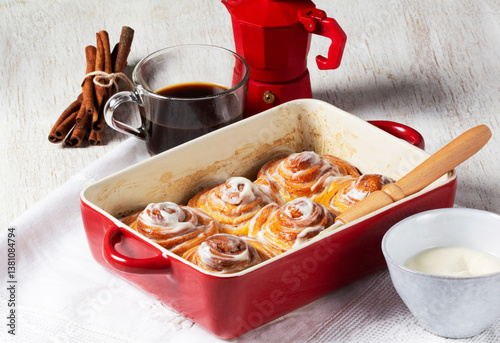 Cinnabons, cinnamon rolls topped with a cream of cream, cheese and sugar.