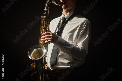 Photography Cropped shot of male musician dressed in formal white shirt and black tie pushin