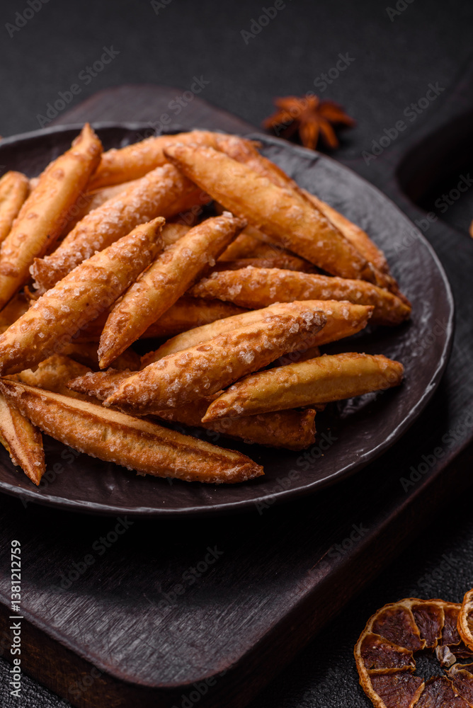 Cinnamon flavored biscuits or breadsticks Cinnamon flavored biscuits or breadsticks