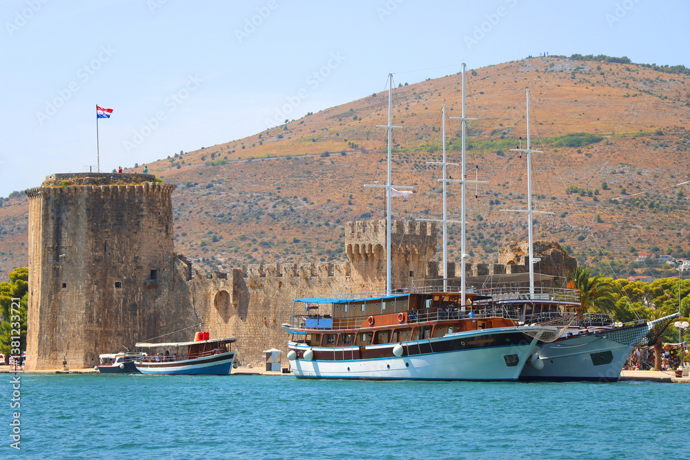 Historical Kamerlengo Fortress in Trogir, Croatia and Croatian flag.