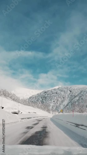 Vertical view of Norway road from car
