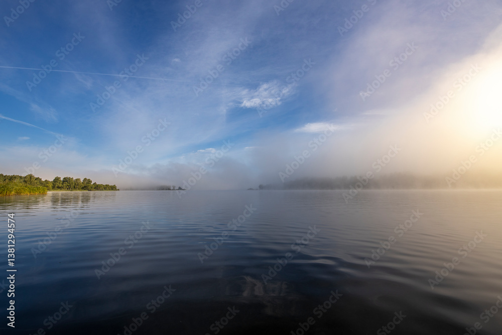 Fototapeta premium The sky is blue and the water is calm
