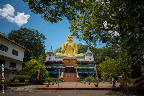 Giant gold-plated Buddha statue in a Buddhist temple in Dambulla, Sri Lanka. 