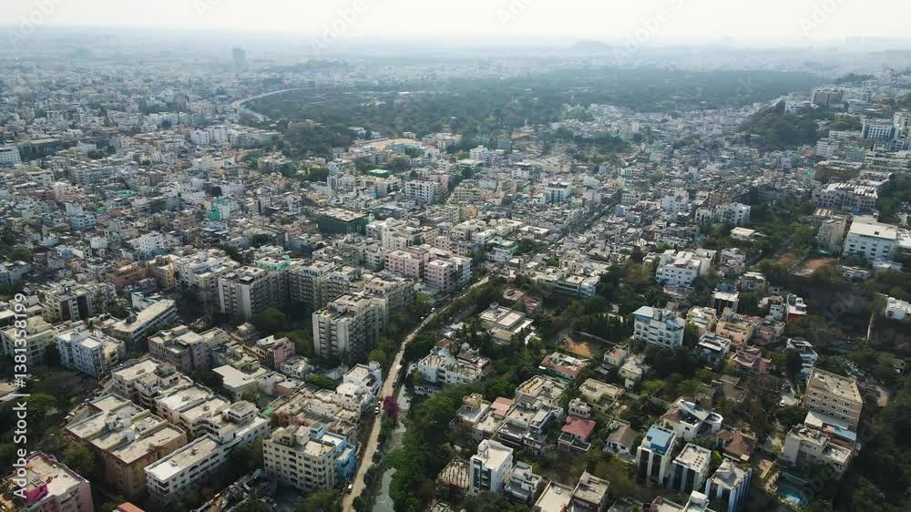 Aerial drone shot showing the structured layout of Hyderabad’s urban zones, featuring commercial hubs, residential complexes, and industrial areas. Aerial drone shot showing the structured layout of Hyderabad’s urban zones, featuring commercial hubs, residential complexes, and industrial areas.