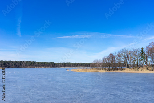 Melting ice on a forest lake