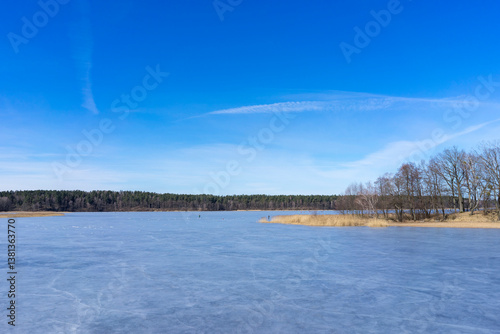Melting ice on a forest lake