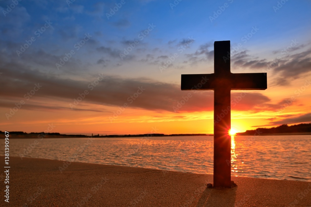 Dark wooden cross with a rising sun behind it, over a wide river. Dark wooden cross with a rising sun behind it, over a wide river.