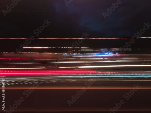 Selective focus photography. A frame in motion. Abstract background. Colorful image. Long shutter speed. Light streaks. Movement of transportation. Shooting from transportation. Blurred image