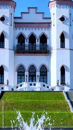 Belarus, Puslovsky Palace, September 5, 2024: Kossovsky Autumn Castle. An old historical castle in Kosovki in sunny autumn weather. An architectural monument in the style of English Neo-Gothic. 4K photo