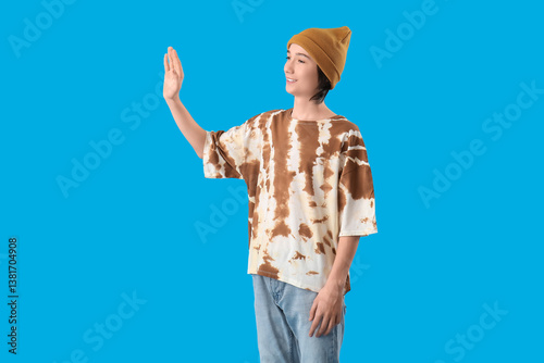 Teenage boy waving hand on ...