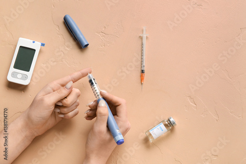Diabetic woman using lancet...