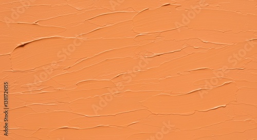 A textured background featuring a warm, peachy-orange color with smooth and subtle brush strokes. Ideal for use in design projects, wallpapers, or as a base for artistic compositions.