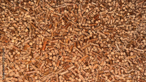 Obraz na płótnie Close-up of brown wood pellets for biomass heating, renewable energy, eco-friendly fuel or sustainable energy resource themes in industrial and home settings w salonie