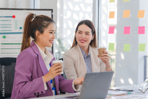 Two Businesswomen Collaborating in Office