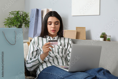 Young woman online shopping...