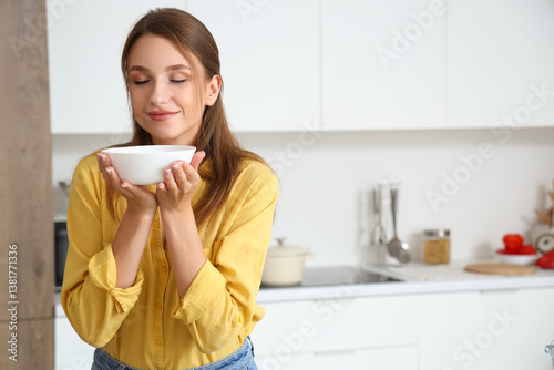 Young woman with bowl of ch...
