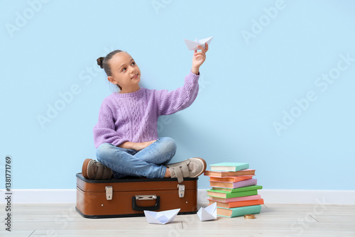 Cute little girl with paper...