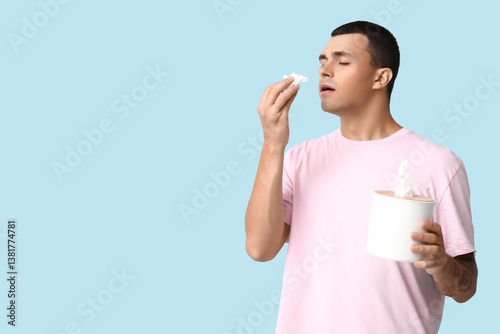 Ill young man with tissues ...