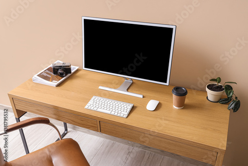 Stylish workplace with mode...