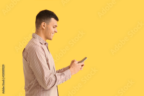 Young man using mobile phon...