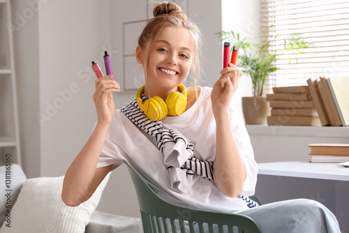 Young woman in headphones h...